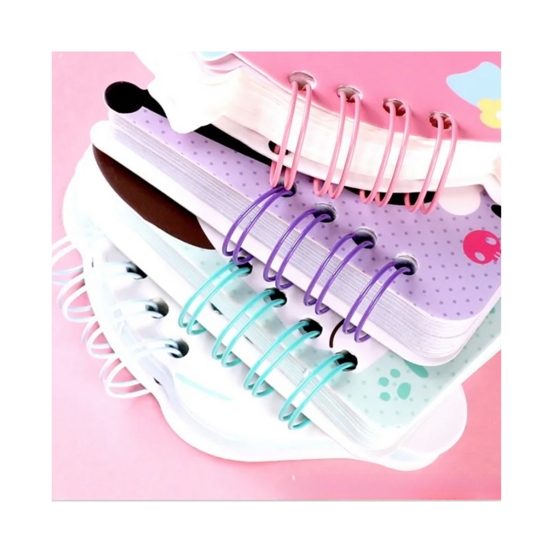 Set of colorful ring binders on a pink background