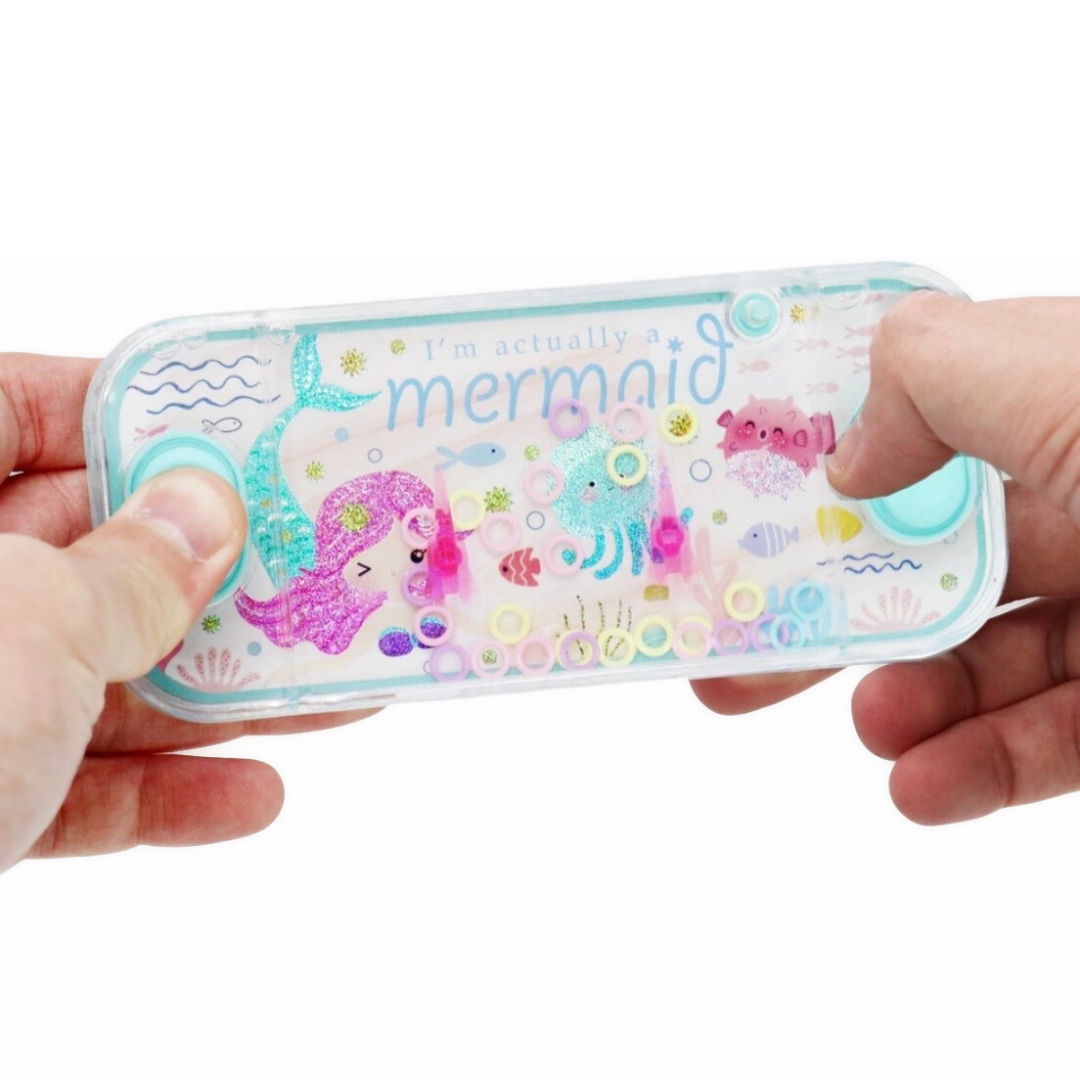 Hand holding a small case with mermaid design and text 'I'm actually a mermaid' on a white background