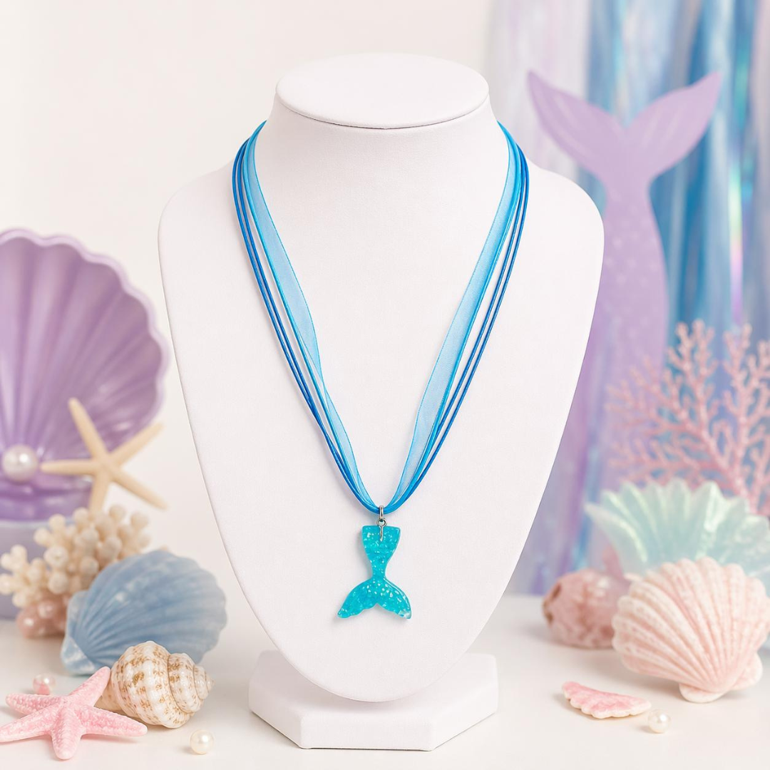 Mermaid tail necklace on a mannequin bust with seashell and starfish decorations.