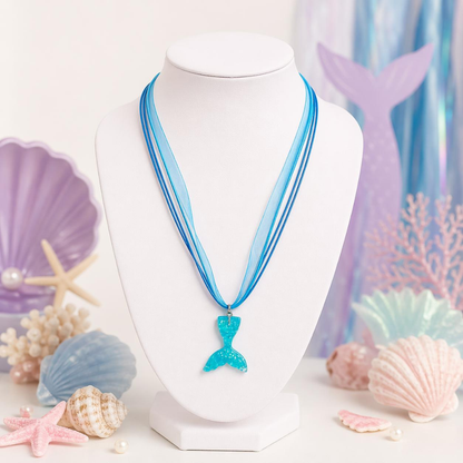 Mermaid tail necklace on a mannequin bust with seashell and starfish decorations.