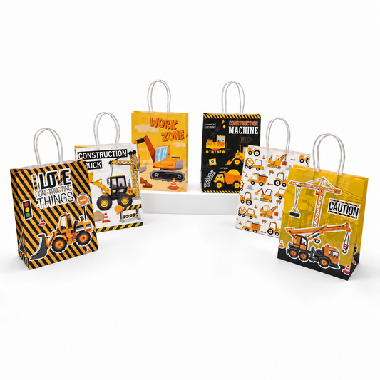 Six construction-themed paper gift bags with white handles, displayed on a white riser against a white background. The bags feature various yellow and black construction vehicle and machine illustrations with text like 'I LOVE CONSTRUCTION', 'WORK ZONE', 'MACHINE', and 'CAUTION'.
