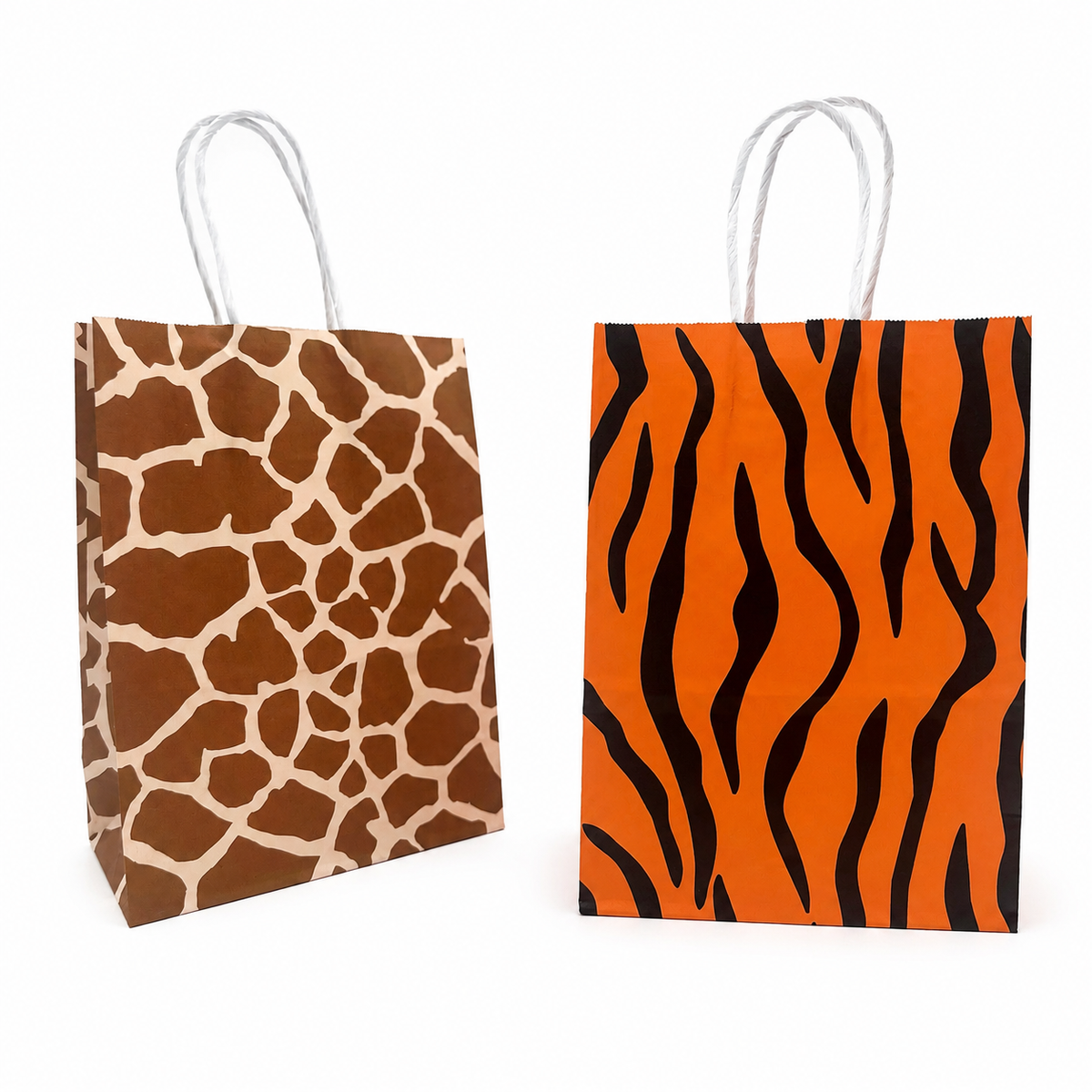 Two paper gift bags with twisted white handles on a white background. The left bag has a brown and beige giraffe print, and the right bag has an orange and black tiger stripe pattern.