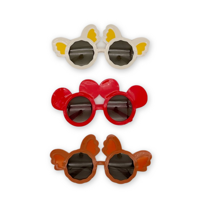 A set of three Mickey Mouse-themed sunglasses in red, white, and brown colors with black lenses and cartoonish designs.