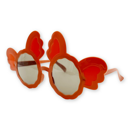 A pair Mickey Mouse-themed sunglasses in orange color with black lenses and cartoonish designs.