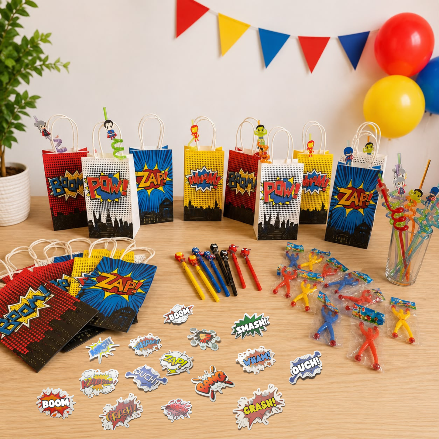a table with superheroes party favors 