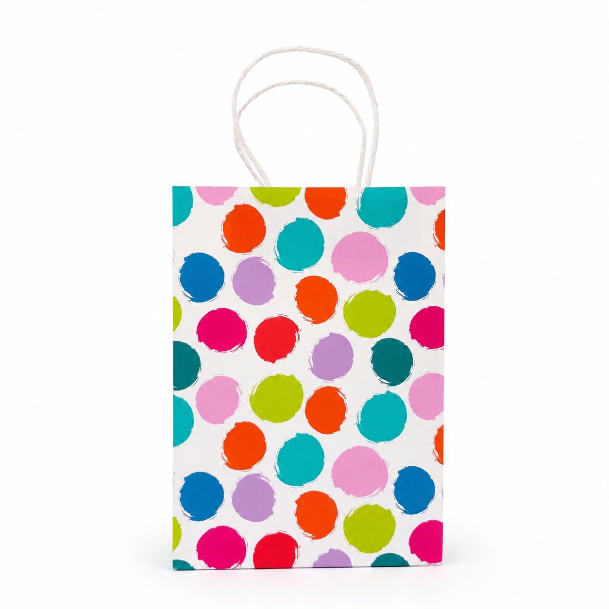 A small paper gift bag with white twisted handles, featuring a colorful pattern of hand-painted style polka dots in pink, blue, orange, green, and purple on a white background.