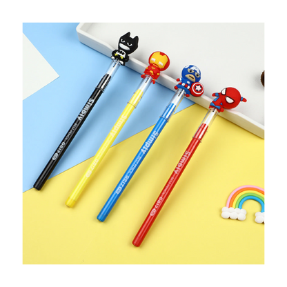 A set of four colorful multi-point pencils, each with a different superhero figure on the top displayed on a pastel blue and yellow desk.