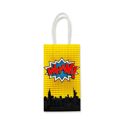 yellow comic style paper favor bags with handles featuring comic words wham on a white background.