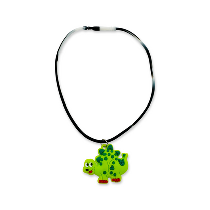 A silicone rubber necklace with green dinosaur design.