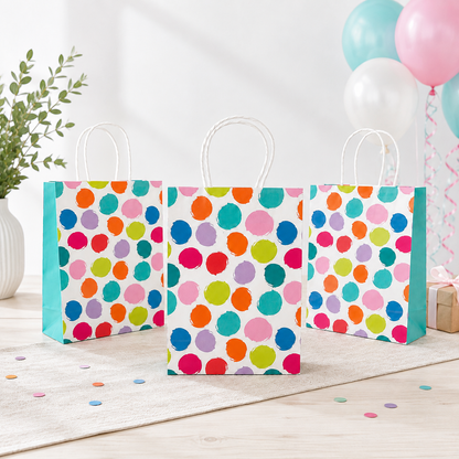 a set of 3 bags on a wooden table with ballons on a background