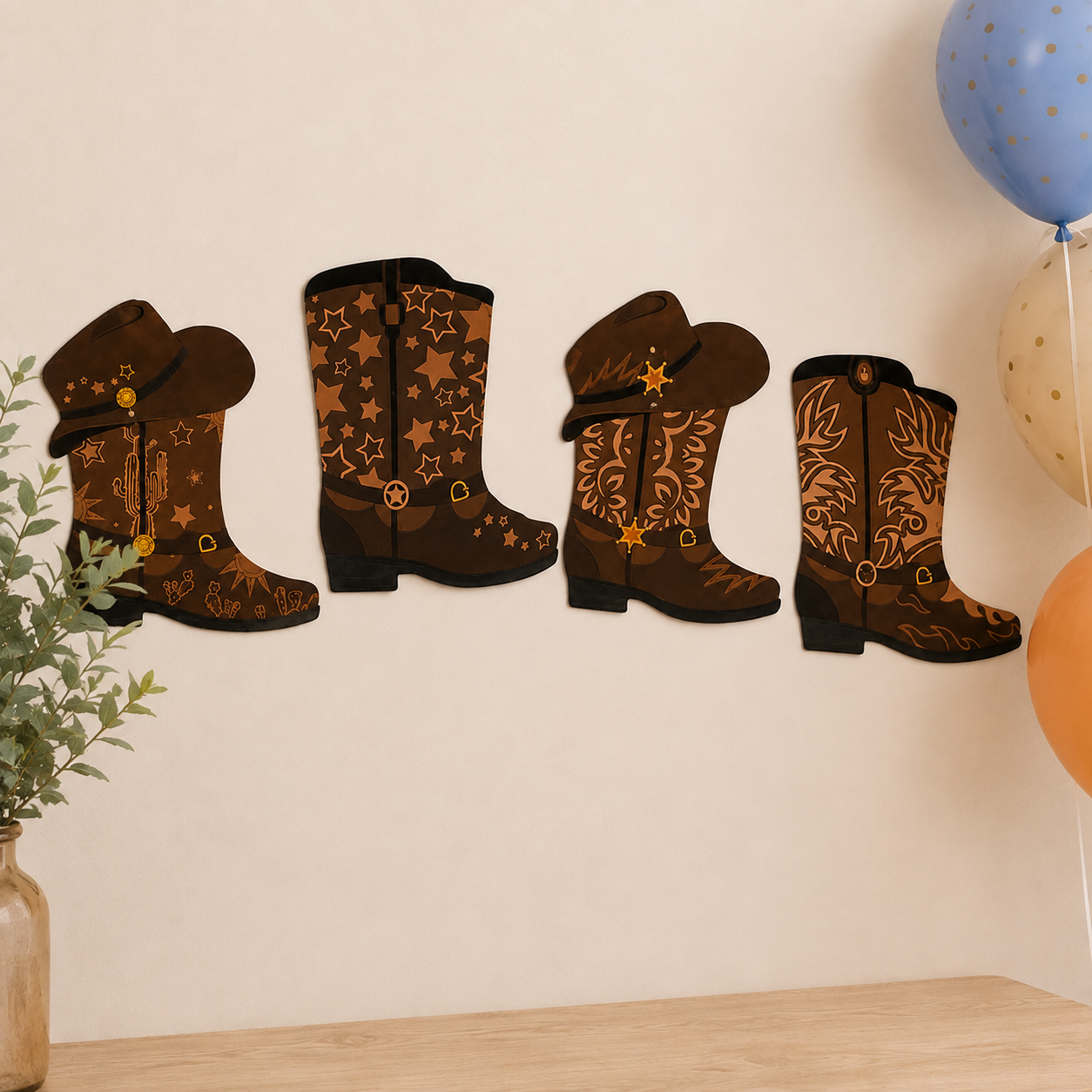 Four brown cowboy boot wall decorations with western patterns, displayed on a beige wall above a wooden surface with balloons and a plant in the background.